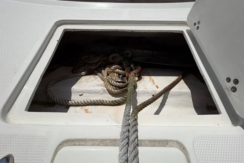 Slide: The Image of Open storage compartment with ropes on a 2019 World Cat 230 CC boat. - 50