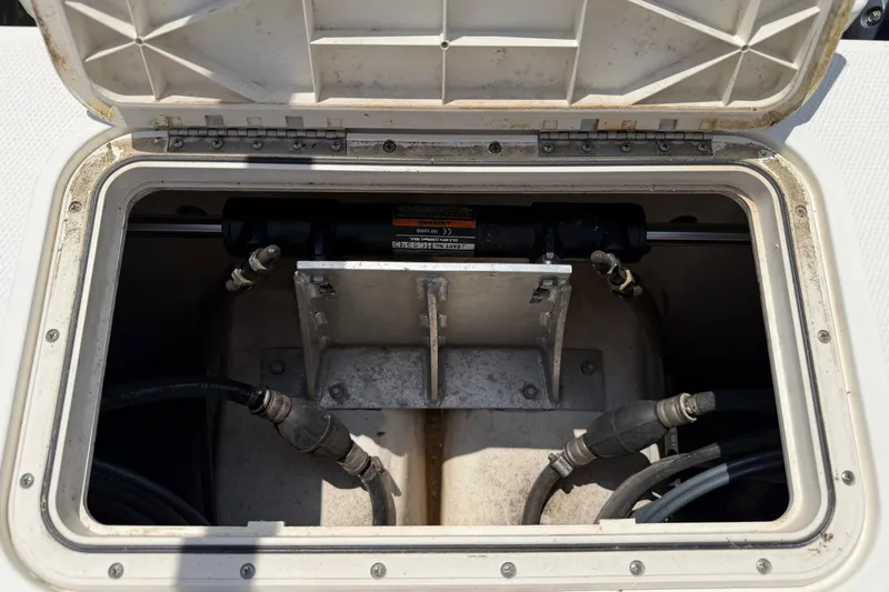 Slide: The Image of Open hatch of a 2019 World Cat 230 CC boat showing internal components. - 51