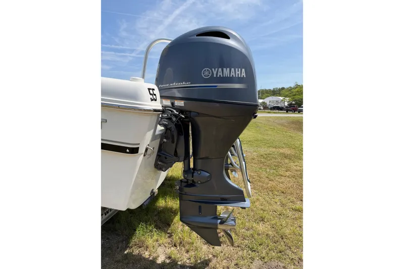 Slide: The Image of 2019 World Cat 230 CC with Yamaha outboard motor on grassy area. - 55