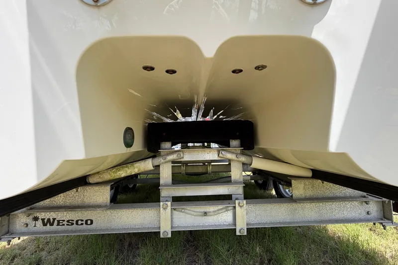 Slide: The Image of Underside view of a 2019 World Cat 230 CC boat on a Wesco trailer. - 67