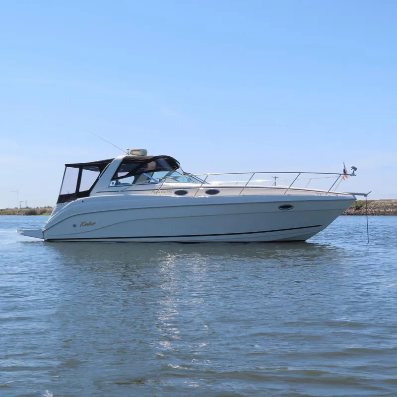 The Image of 2002 Rinker 342 Fiesta Vee boat on calm water. - 0