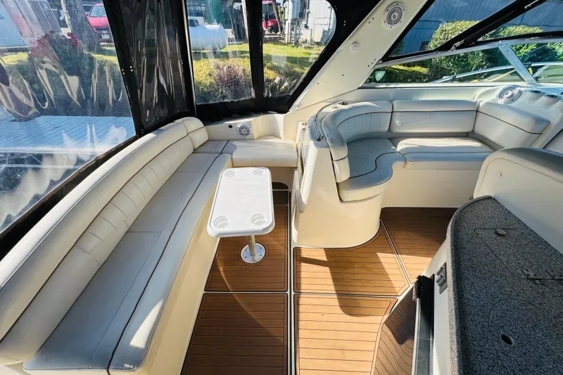 Slide: The Image of Interior of 2002 Rinker Fiesta Vee 342 boat with plush seating and wooden flooring. - 17