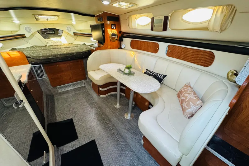 Slide: The Image of Interior of 2002 Rinker Fiesta Vee 342 boat with cozy seating and elegant decor. - 2