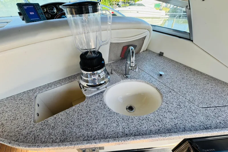 Slide: The Image of 2002 Rinker Fiesta Vee 342 boat interior with sink and blender on granite countertop. - 22
