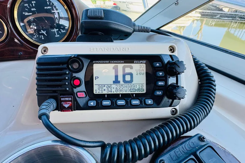 Slide: The Image of Standard Horizon marine radio on 2002 Rinker Fiesta Vee 342 boat dashboard. - 32