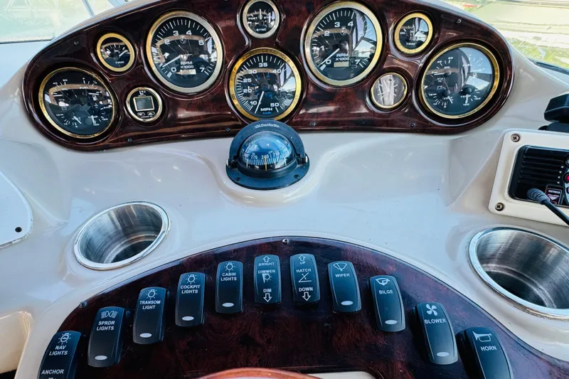 Slide: The Image of Dashboard of 2002 Rinker Fiesta Vee 342 boat with gauges and controls. - 33