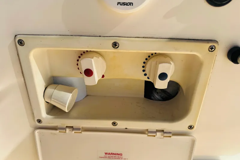 Slide: The Image of Boat control panel with knobs on a 2002 Rinker Fiesta Vee 342. - 35