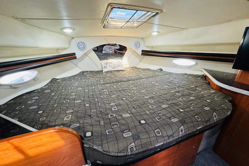 Slide: The Image of Interior cabin of 2002 Rinker Fiesta Vee 342 with bed and portholes. - 41