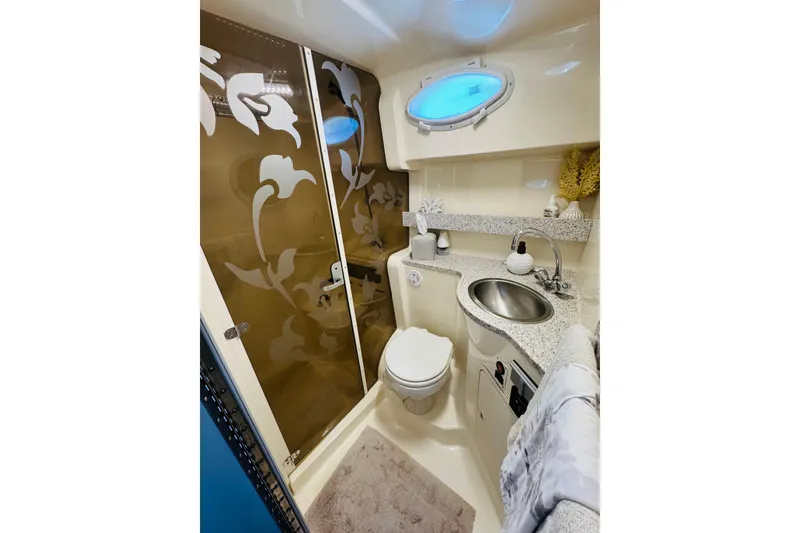 Slide: The Image of Luxurious bathroom in 2002 Rinker Fiesta Vee 342 yacht with floral shower door. - 46