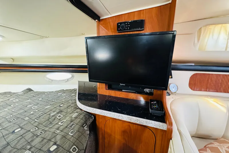 Slide: The Image of Interior of 2002 Rinker Fiesta Vee 342 with TV and cozy seating area. - 48