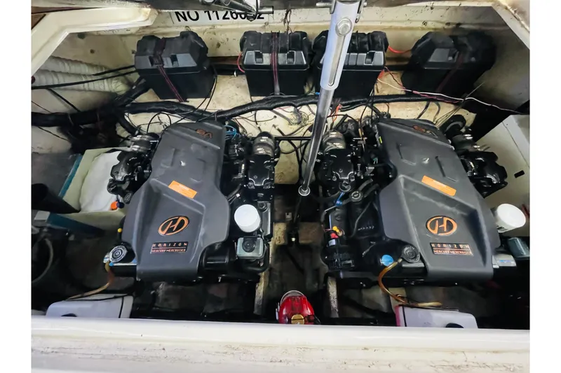 Slide: The Image of Engine compartment of a 2002 Rinker Fiesta Vee 342 boat with dual engines. - 51