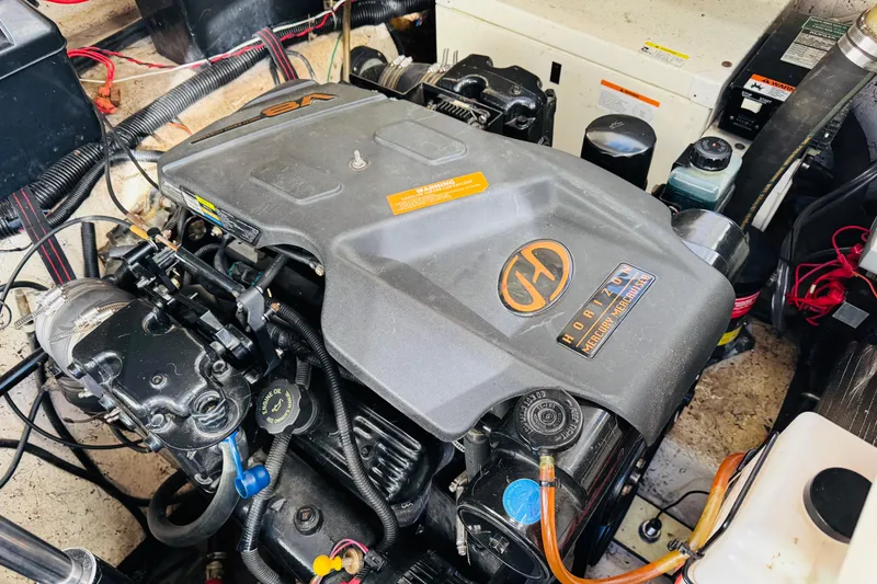 Slide: The Image of Engine compartment of a 2002 Rinker Fiesta Vee 342 boat, featuring a Horizon engine. - 52