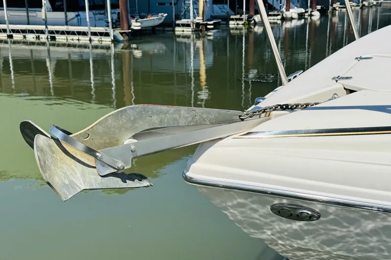 Slide: The Image of Bow of 2002 Rinker Fiesta Vee 342 with anchor, docked in marina. - 9