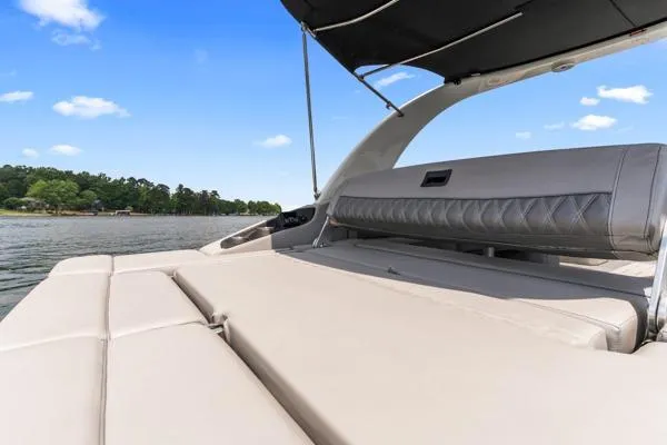 Slide: The Image of 2023 Bennington QX 25 QXSBA luxury boat interior with lake view. - 13