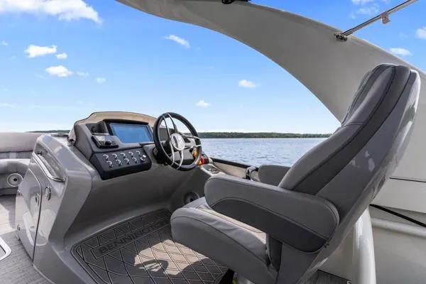 Slide: The Image of 2023 Bennington QX 25 QXSBA boat interior with steering wheel and control panel. - 16