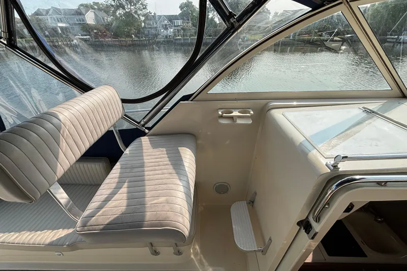 Slide: The Image of 2005 Mainship Pilot 30-II Sedan interior with seating and water view. - 14