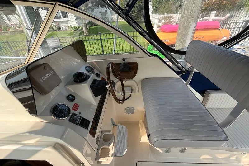Slide: The Image of 2005 Mainship Pilot 30-II Sedan helm with Garmin navigation and cushioned seating. - 15