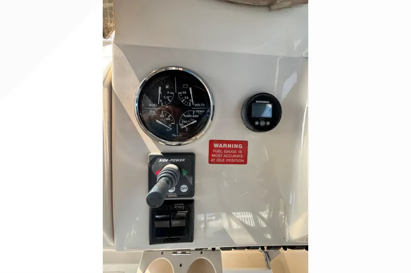 Slide: The Image of 2005 Mainship Pilot 30-II Sedan dashboard with gauges and controls. - 17