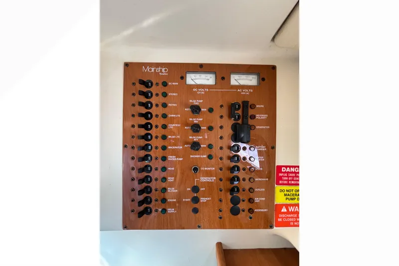 Slide: The Image of Electrical control panel of 2005 Mainship Pilot 30-II Sedan boat. - 21