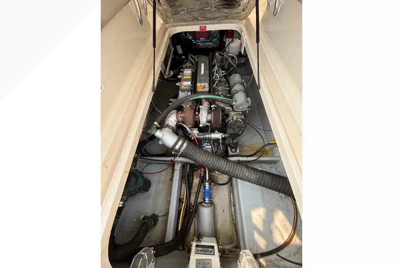 Slide: The Image of Engine compartment of a 2005 Mainship Pilot 30-II Sedan, showcasing mechanical components. - 35