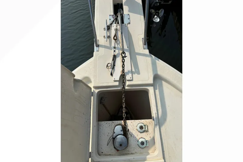 Slide: The Image of Anchor chain and storage compartment on 2005 Mainship Pilot 30-II Sedan boat. - 36