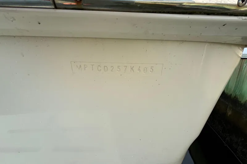 Slide: The Image of 2005 Mainship Pilot 30-II Sedan boat hull with visible identification number. - 37