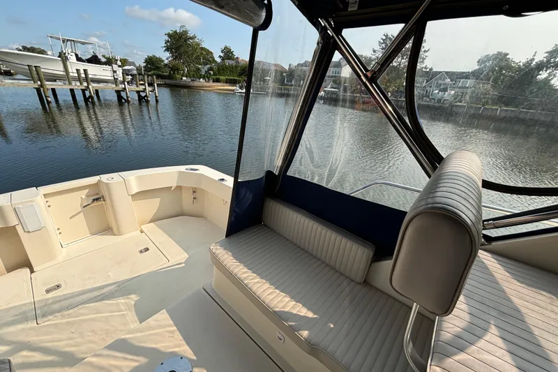 Slide: The Image of 2005 Mainship Pilot 30-II Sedan boat interior with waterfront view. - 5