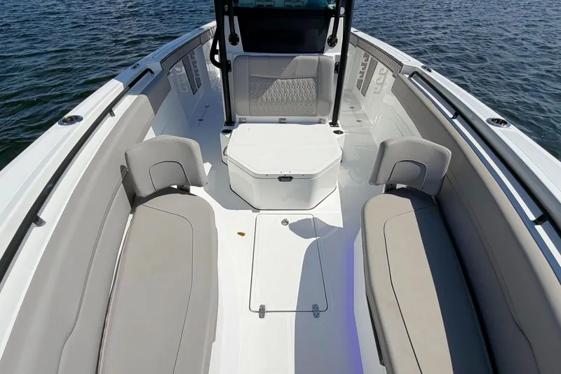Slide: The Image of 2021 Wellcraft 302 Fisherman boat interior with seating, on calm water. - 20