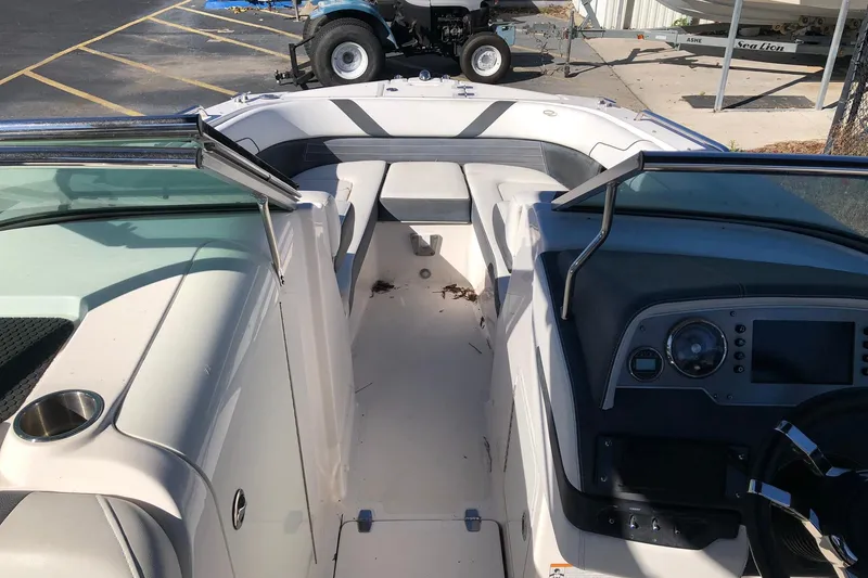 Slide: The Image of 2017 Regal 24 FasDeck boat interior with seating and dashboard view. - 7