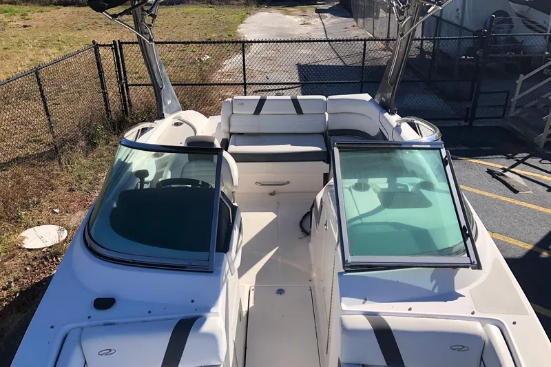 Slide: The Image of 2017 Regal 24 FasDeck boat with open cockpit and seating, viewed from above. - 9
