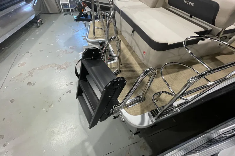 Slide: The Image of 2026 Harris Cruiser 210 SL boat interior with foldable ladder and seating area. - 10