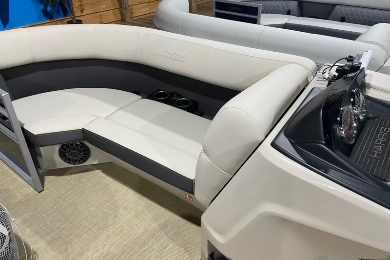 Slide: The Image of 2026 Harris Cruiser 210 SL boat interior with plush seating and modern dashboard. - 3