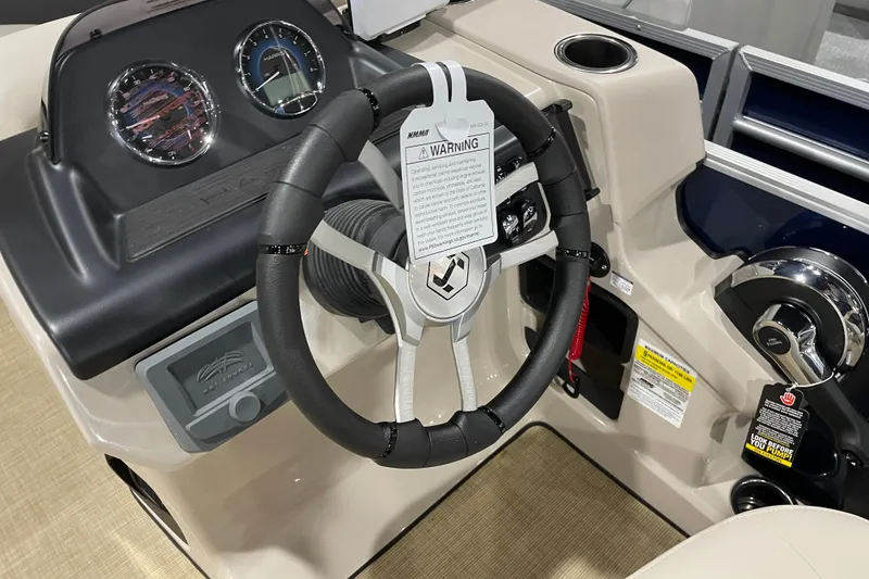 Slide: The Image of Steering console of 2026 Harris Cruiser 210 SL boat with gauges and controls. - 6