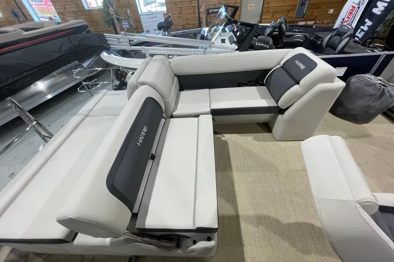 Slide: The Image of 2026 Harris Cruiser 210 SL boat interior with plush seating and modern design. - 8