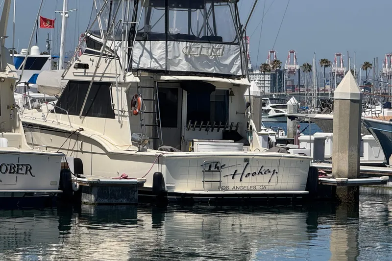 The Image of 1985 Hatteras 45 Convertible yacht docked in a marina, Los Angeles, CA. - 0
