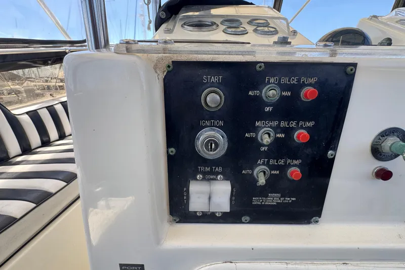 Slide: The Image of Control panel of a 1985 Hatteras 45 Convertible boat with bilge pump switches. - 17
