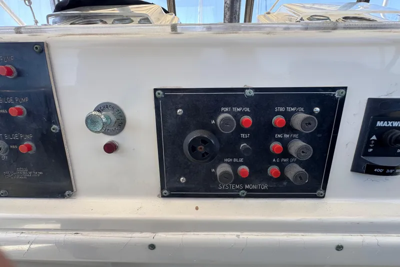 Slide: The Image of Control panel of a 1985 Hatteras 45 Convertible boat, featuring system monitors and switches. - 18