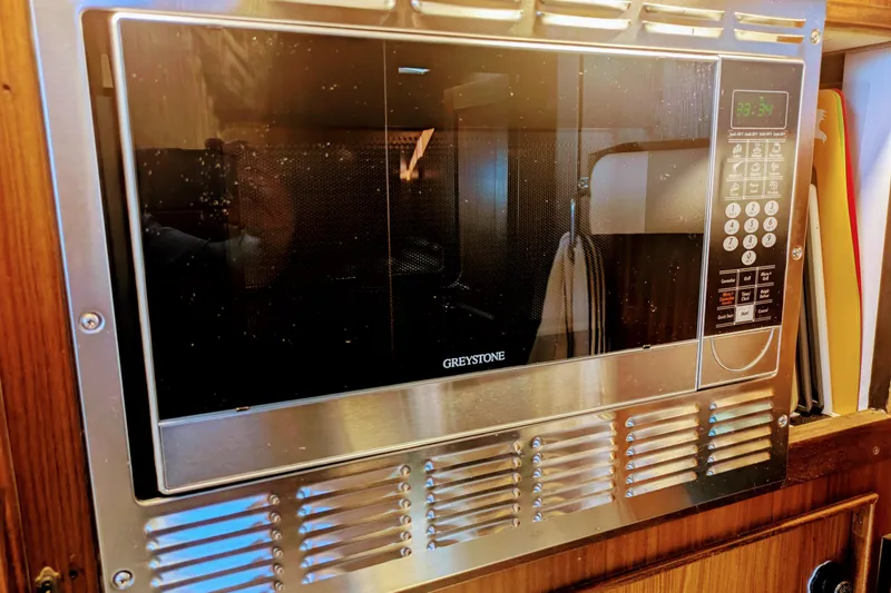 Slide: The Image of Built-in Greystone microwave in 1985 Hatteras 45 Convertible yacht kitchen. - 37