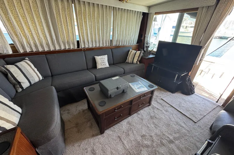 Slide: The Image of Interior of 1985 Hatteras 45 Convertible yacht with cozy seating and TV. - 58