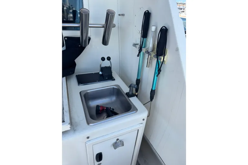 Slide: The Image of Fishing gear and sink on 1985 Hatteras 45 Convertible boat deck. - 6