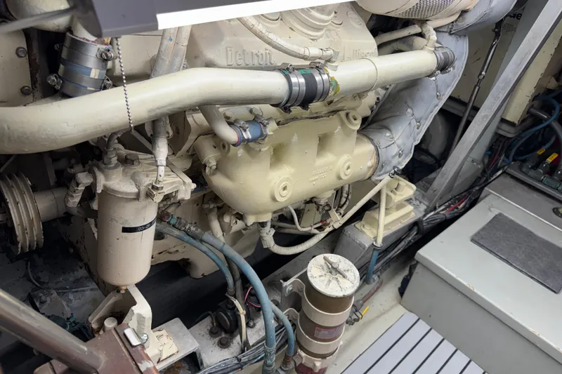 Slide: The Image of Engine room of a 1985 Hatteras 45 Convertible yacht, showcasing mechanical components. - 63