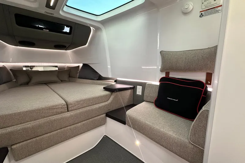 Slide: The Image of Luxurious interior of 2024 Axopar 37 Sun-Top with modern seating and ambient lighting. - 10