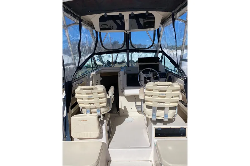 Slide: The Image of Interior view of 2001 Grady-White Gulfstream 232 boat with helm and seating. - 11