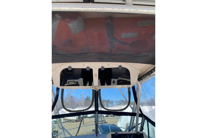 Slide: The Image of 2001 Grady-White Gulfstream 232 boat interior with overhead storage compartments. - 7
