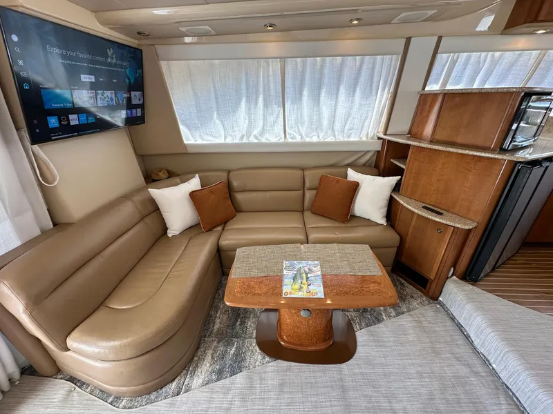 Slide: The Image of Luxurious interior of a 2007 Meridian 411 Sedan yacht with leather seating and modern amenities. - 24