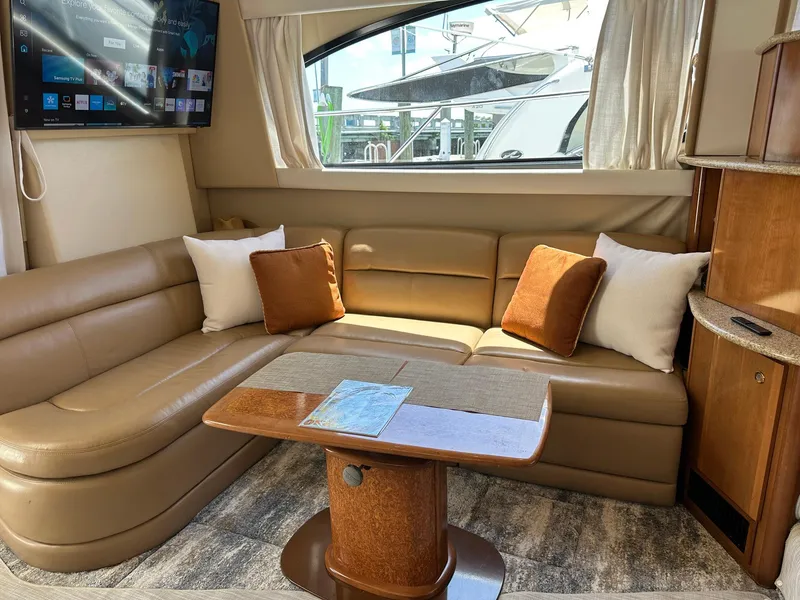 Slide: The Image of Luxurious interior of 2007 Meridian 411 Sedan with leather seating and wooden table. - 25