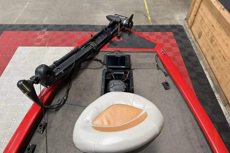 Slide: The Image of 2007 Tracker Pro Team 175 TXW boat interior with trolling motor and seat. - 6