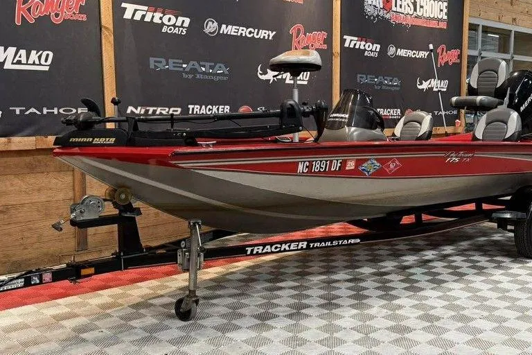 Slide: The Image of 2007 Tracker Pro Team 175 TXW boat on display with branded backdrop. - 7
