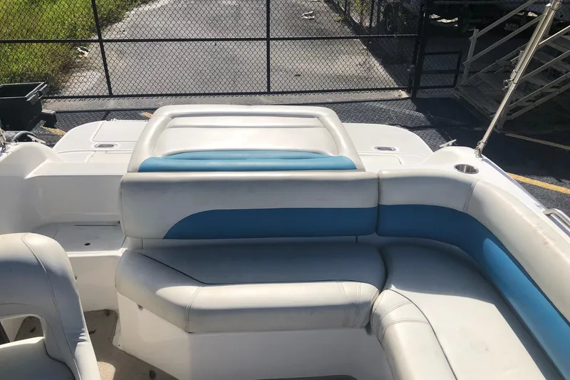 Slide: The Image of 2014 Hurricane SunDeck Sport 201 IO boat interior with white and blue seating. - 10