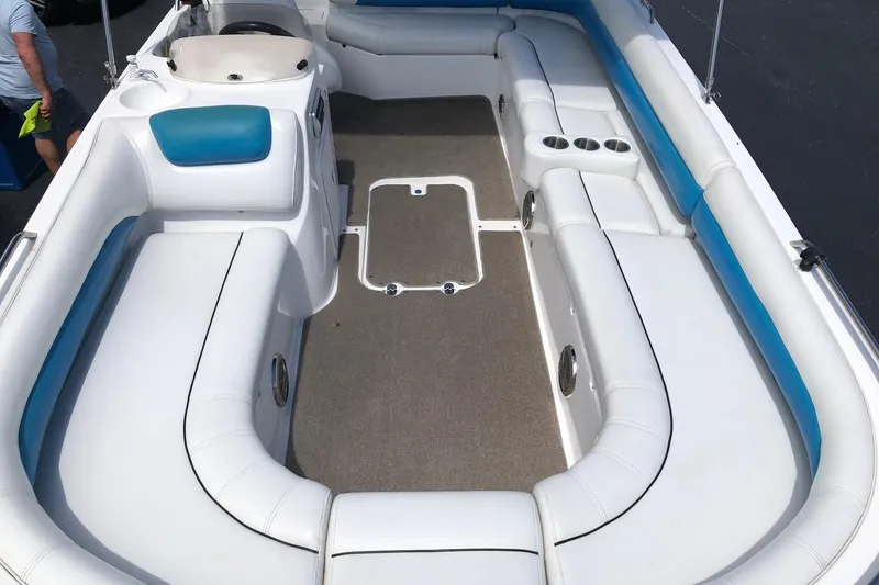 Slide: The Image of 2014 Hurricane SunDeck Sport 201 IO boat interior with white and blue seating. - 15